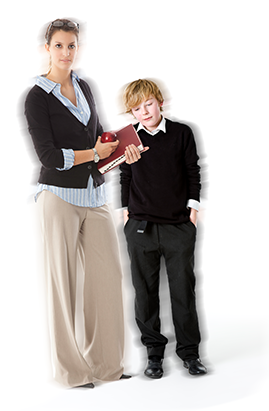 A woman with glasses on her head holding a notebook and an apple standing next to a young boy in school uniform