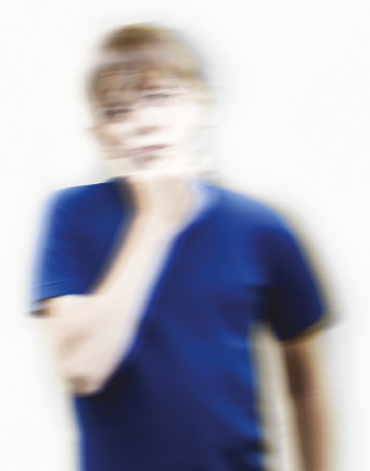 Blurred image of a boy thinking