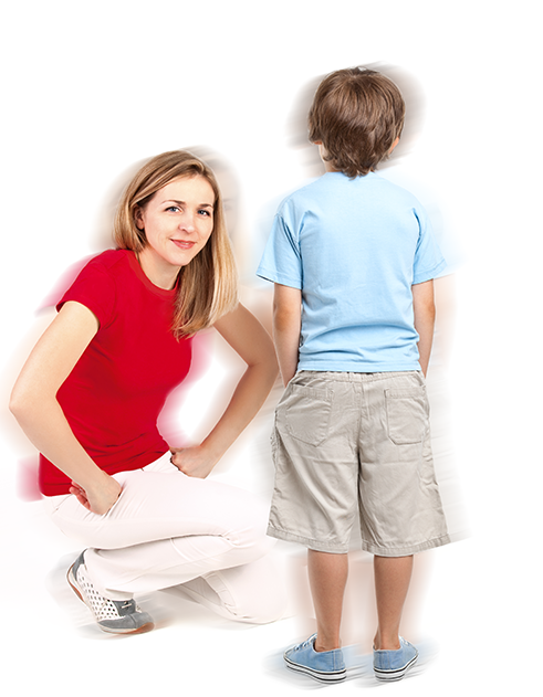 Woman kneeling in front of a young boy